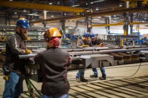 several employees work on a Lode King trailer